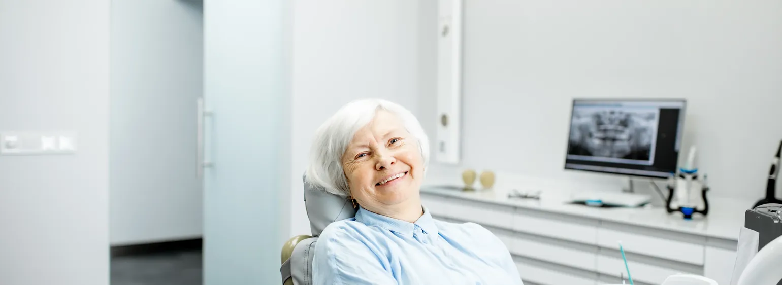 Smiling senior woman in a dental chair