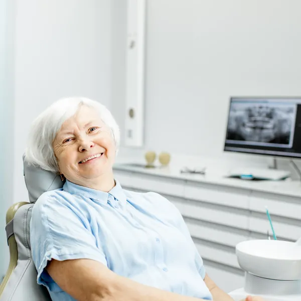 Smiling senior woman in a dental chair