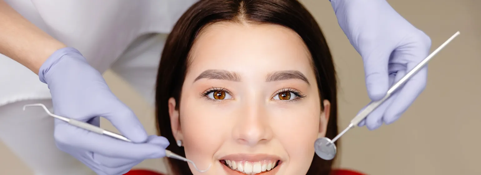 Smiling patient during a dental cleaning