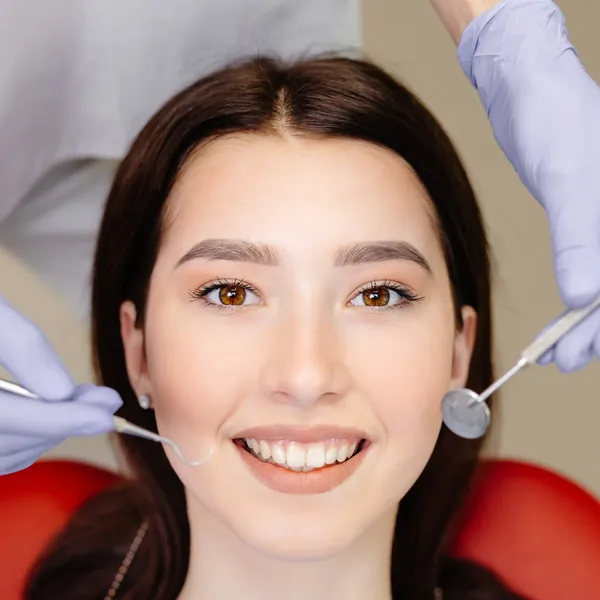 Smiling patient during a dental cleaning
