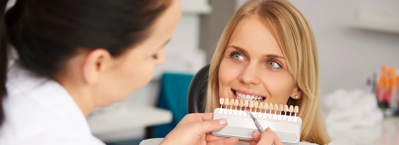 Dentist matching tooth shade for a dental crown