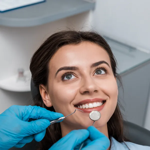 Smiling woman in the dental chair during a checkup