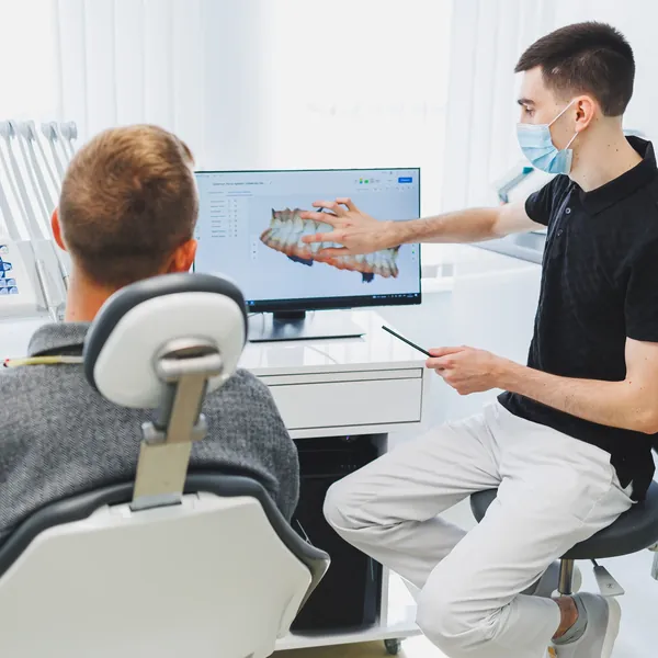 Dentist explaining a digital scan to a patient