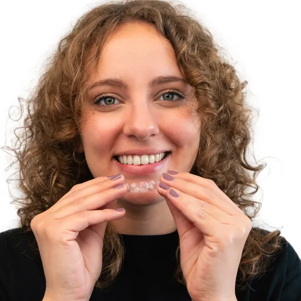 Woman placing a clear aligner