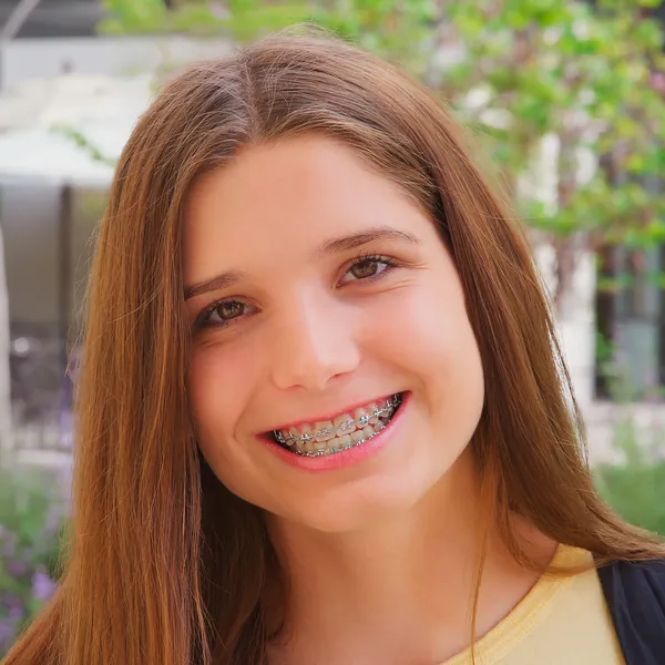 Teenage girl smiling with braces