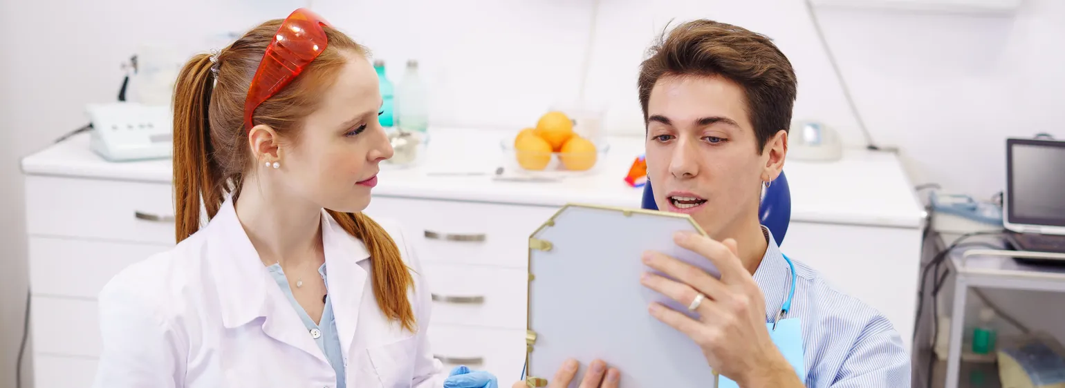 Dentist consulting with a patient