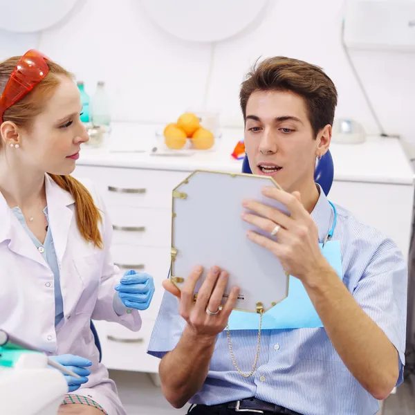 Dentist consulting with a patient